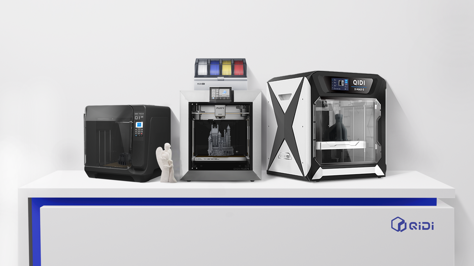 Lineup of three QIDI FDM printers side by side, enclosed chambers for safe, reliable printing across hobbyist to professional needs