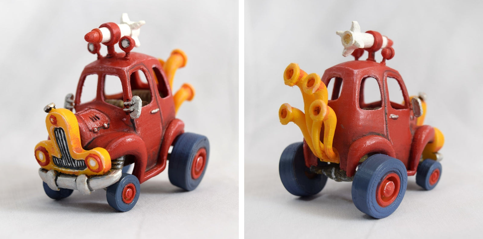 3D‑printed red cartoon car model, front and rear views; oversized wheels, yellow pipes, rocket on roof.