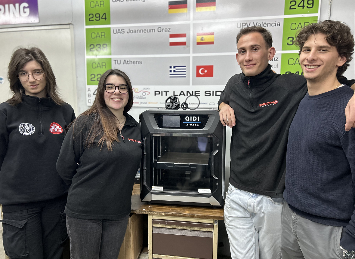 Students posing beside QIDI 3D printer for education
