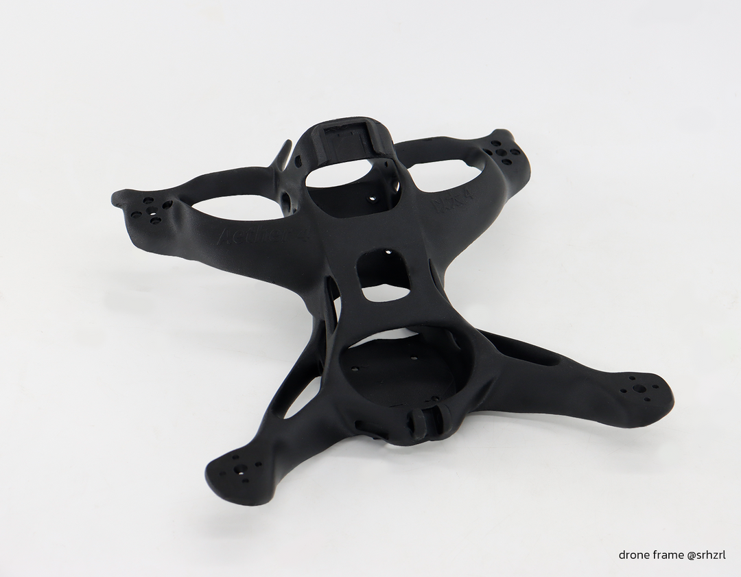 Black Aether 4 drone frame with intricate carbon fiber design and textured finish