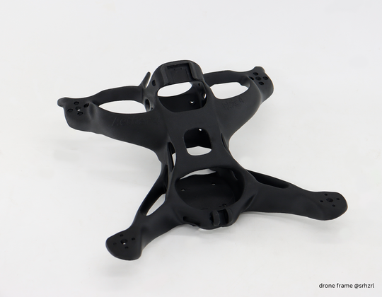 Black Aether 4 drone frame with intricate carbon fiber design and textured finish