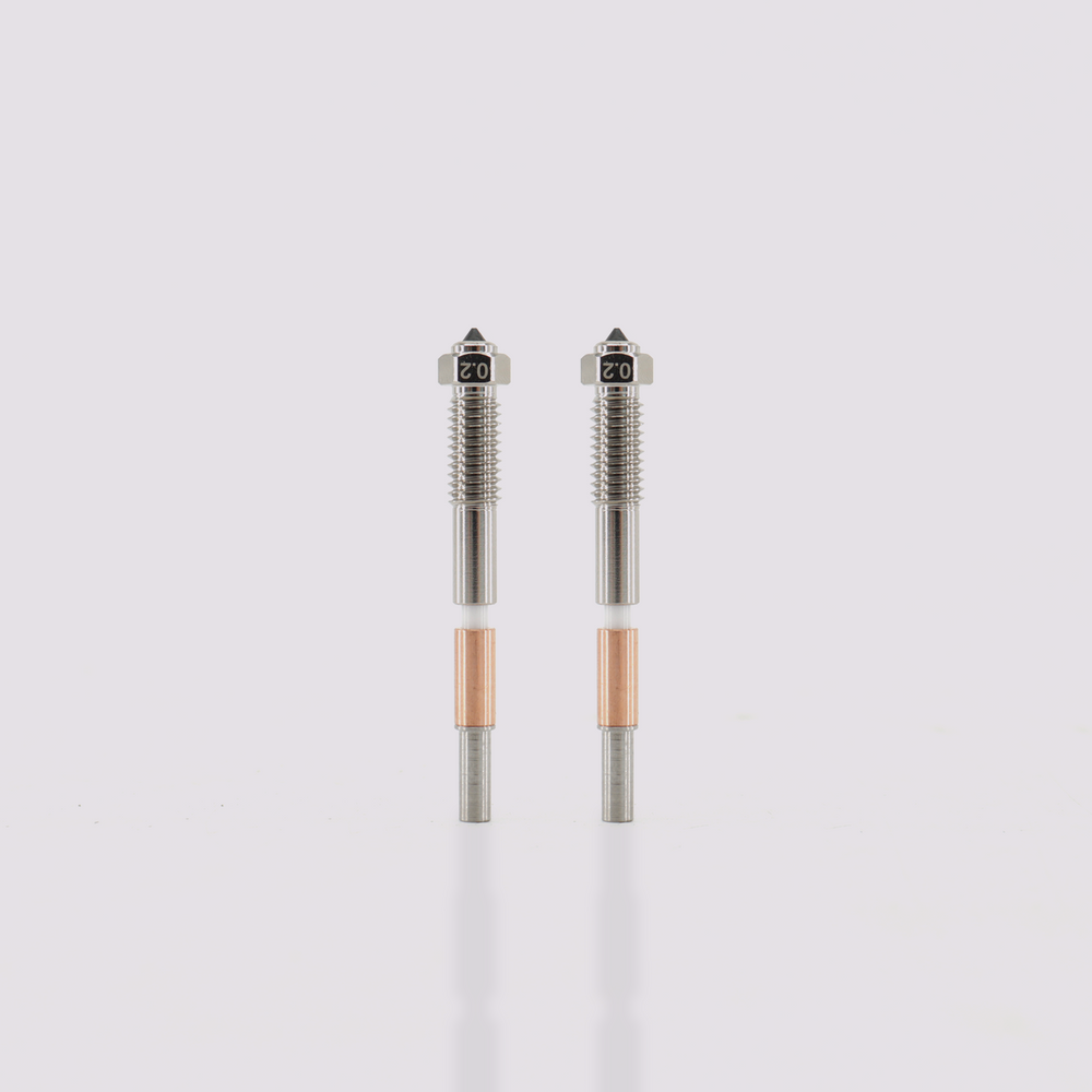 Two Q2 bimetal nozzles 0.2mm tips with hardened steel core and copper-plated exterior