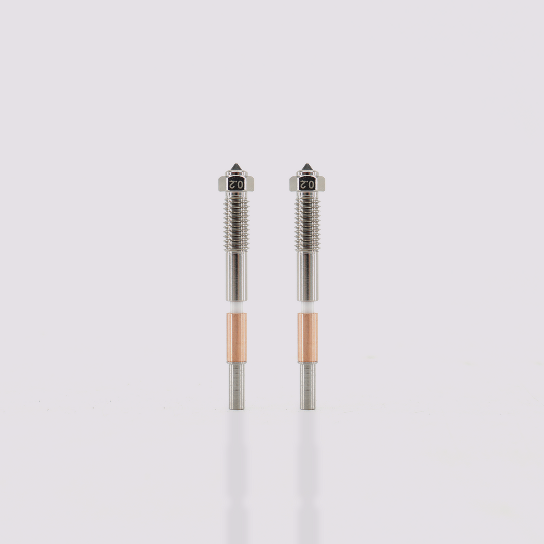 Two Q2 bimetal nozzles 0.2mm tips with hardened steel core and copper-plated exterior