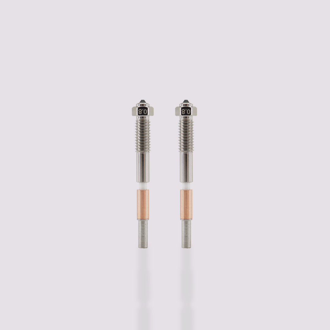 Two Q2 bimetal nozzles with 0.8 mm marking, featuring a silver threaded upper section and a copper heat sink.