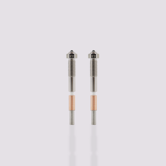 Two Q2 bimetal nozzles with 0.8 mm marking, featuring a silver threaded upper section and a copper heat sink.